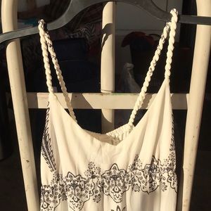 Large white dress with black designs.